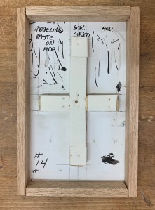 The back bracing of a panel with its frame glued into place.